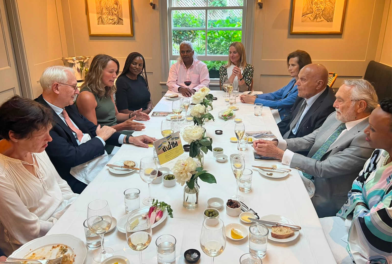 Professor Sir Magdi Yacoub and colleagues discussing cardiovascular care